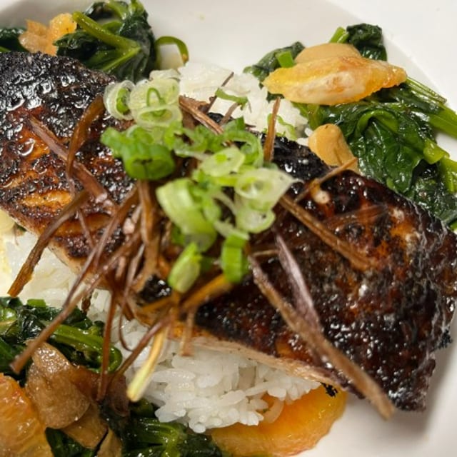 Cast Iron Seared Salmon, Asian Citrus Bbq Sauce, Wild Mushrooms, Garlic Yu Choy Greens, White Rice & Fried Leeks.